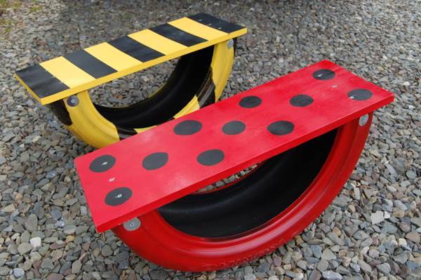 How-to-Repurpose-an-Old-Tire-into-a-Seesaw-DIY-Tutorial-0