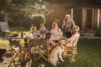 Family relaxing in a sunny backyard with tips to stay cool