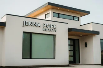 This is a modern house with 'Jenna Pope' written on the wall