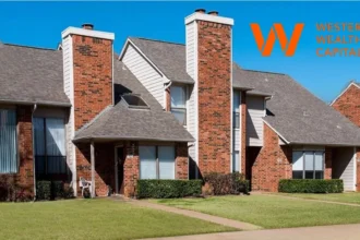 Western Wealth Capital logo with townhomes community in Euless, Texas