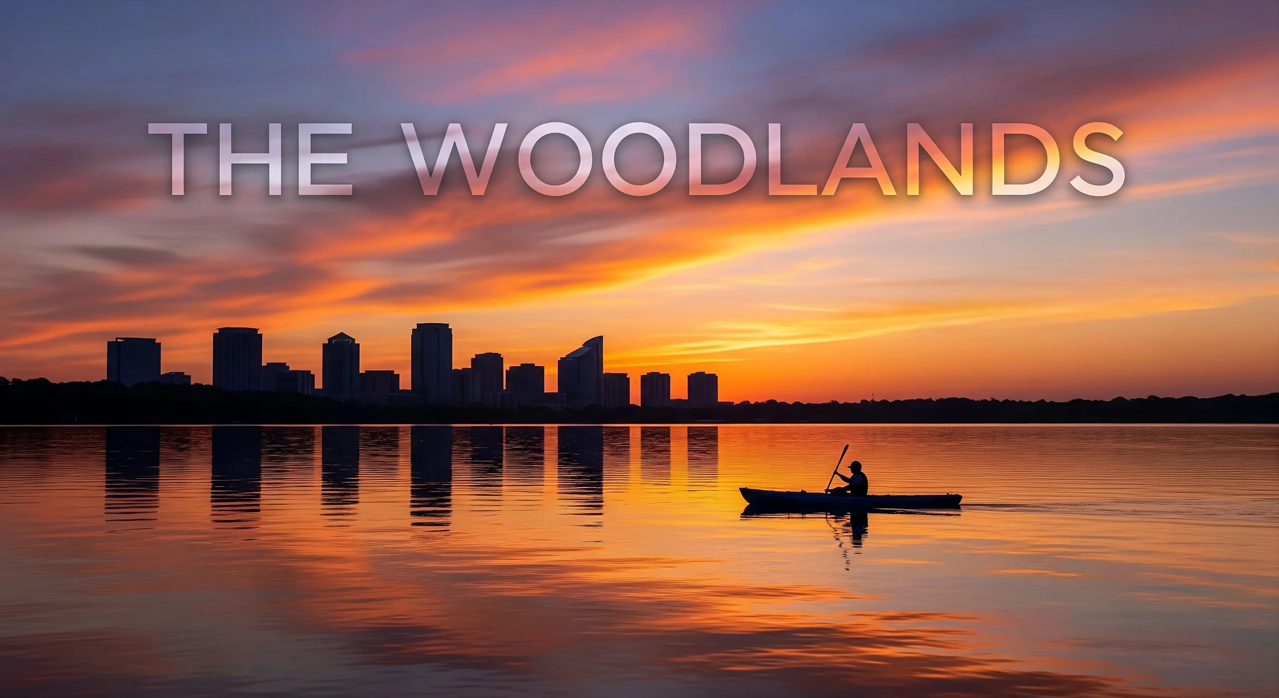 Sunrise on Lake Woodlands with kayaker and distant mid-rises