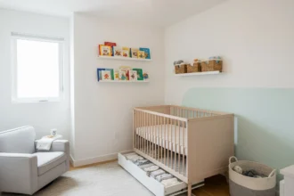 Small modern nursery with compact crib, cozy chair, and built-in storage in a bright Dallas home.