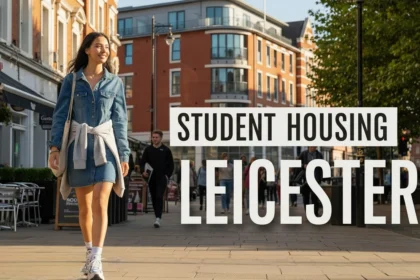 Students walking along a Leicester street near campus with cafés and student apartments in the background