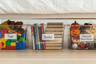 Underbed storage bins holding toys, books, and seasonal decorations