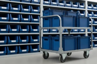 Matching organizer bins arranged on warehouse shelves and a rolling cart.