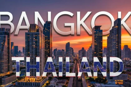 Bangkok luxury condo skyline with BTS Skytrain at sunset