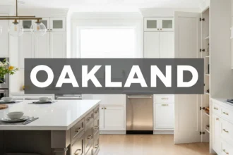 Bright kitchen with ceiling-height cabinets, quartz island, deep drawers, and hidden pantry storage.
