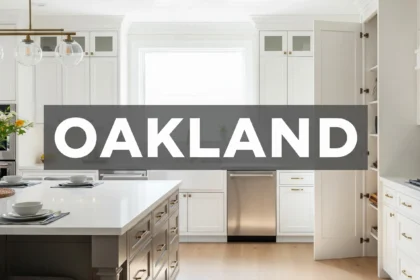 Bright kitchen with ceiling-height cabinets, quartz island, deep drawers, and hidden pantry storage.