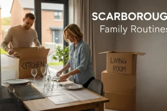 Family setting a dinner table in a newly moved-in Scarborough home with unpacked boxes nearby