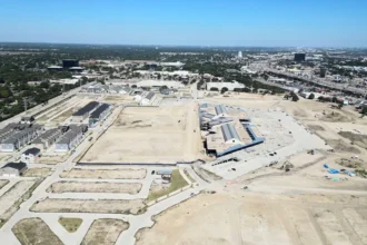 Aerial view of new housing and active construction at the former Collin Creek Mall redevelopment site in Plano, Texas.
