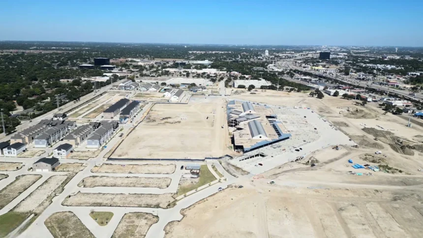 Aerial view of new housing and active construction at the former Collin Creek Mall redevelopment site in Plano, Texas.