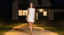 Tenant walking on a lit rental property pathway
