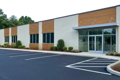 Refreshed Austin commercial building exterior with newly sealed parking lot