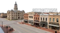 Historic downtown square in Georgetown TX with courthouse and shops