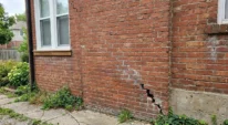 Stair-step crack in exterior brick wall