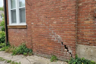 Stair-step crack in exterior brick wall